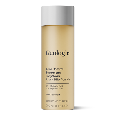 A gold cylindrical bottle labeled Geologie Acne Control Superclean Body Wash with 2% Salicylic Acid, 1.5% Glycolic Acid, 250 ml. Dermatologist tested to prevent breakouts and provide effective acne treatment.